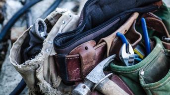 Tool belt and carpentry tools; photo credit: Unsplash 