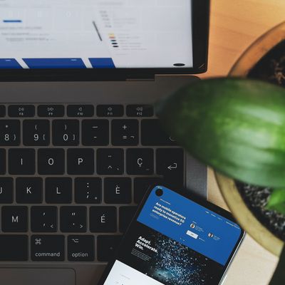 Photo Credit: https://unsplash.com/photos/QuusekRfTI8 / A computer, tablet, and plant on a desk